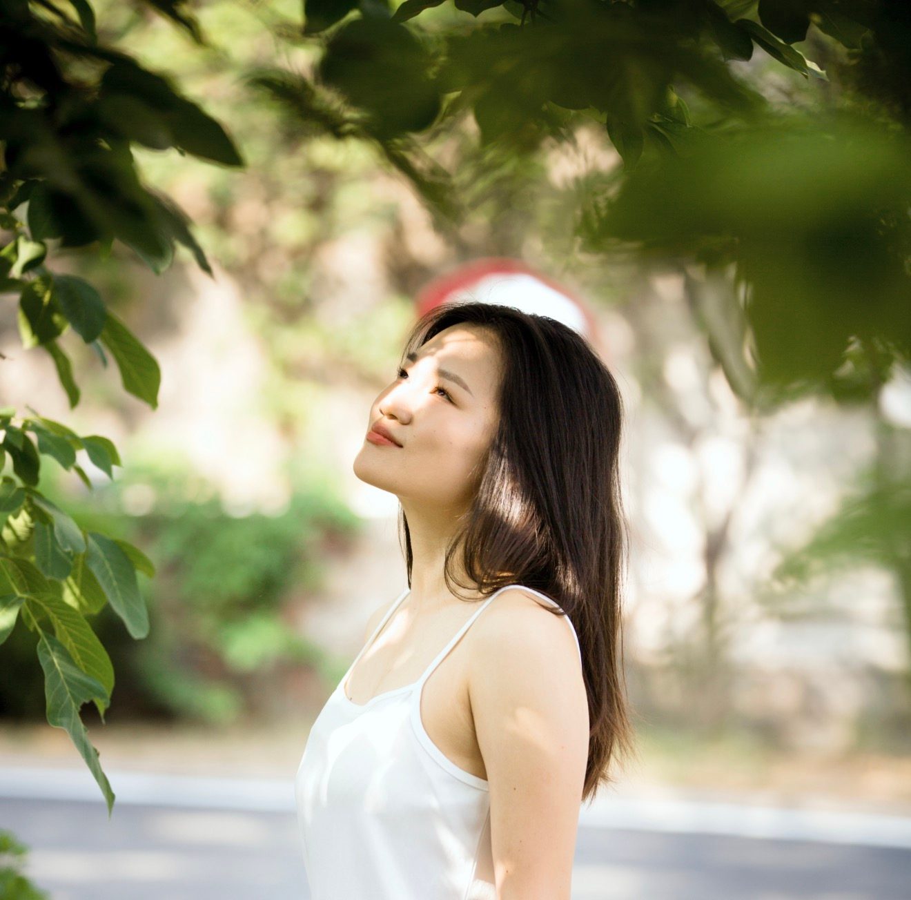Ginger Phoenix in a white dress, photographed outdoors